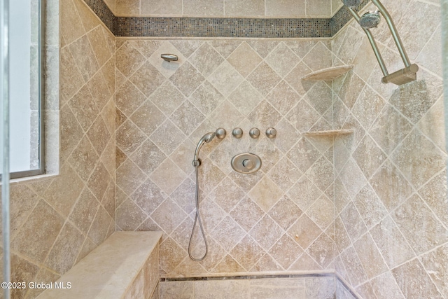 bathroom featuring tiled shower