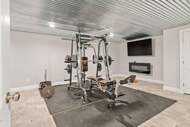 exercise room with baseboards