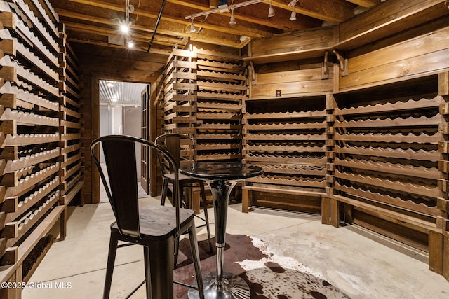wine room featuring concrete flooring