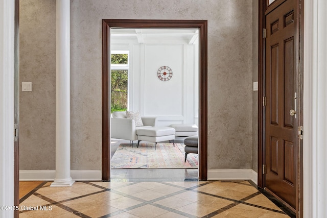 entrance foyer with inlaid floor details and baseboards