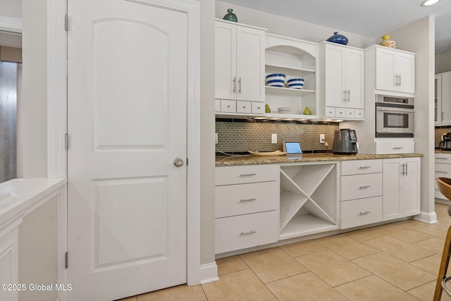 kitchen featuring open shelves, oven, tasteful backsplash, white cabinets, and recessed lighting