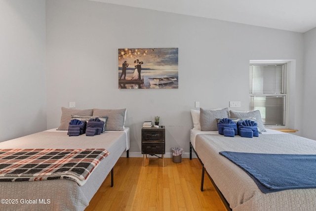 bedroom featuring wood finished floors