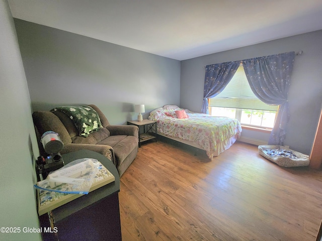 bedroom with wood finished floors