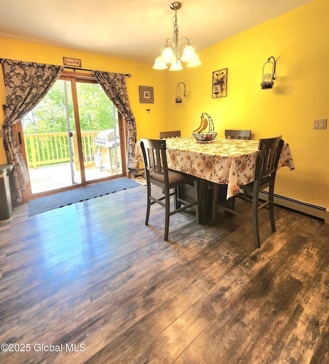 dining space featuring a chandelier, wood finished floors, and a baseboard heating unit