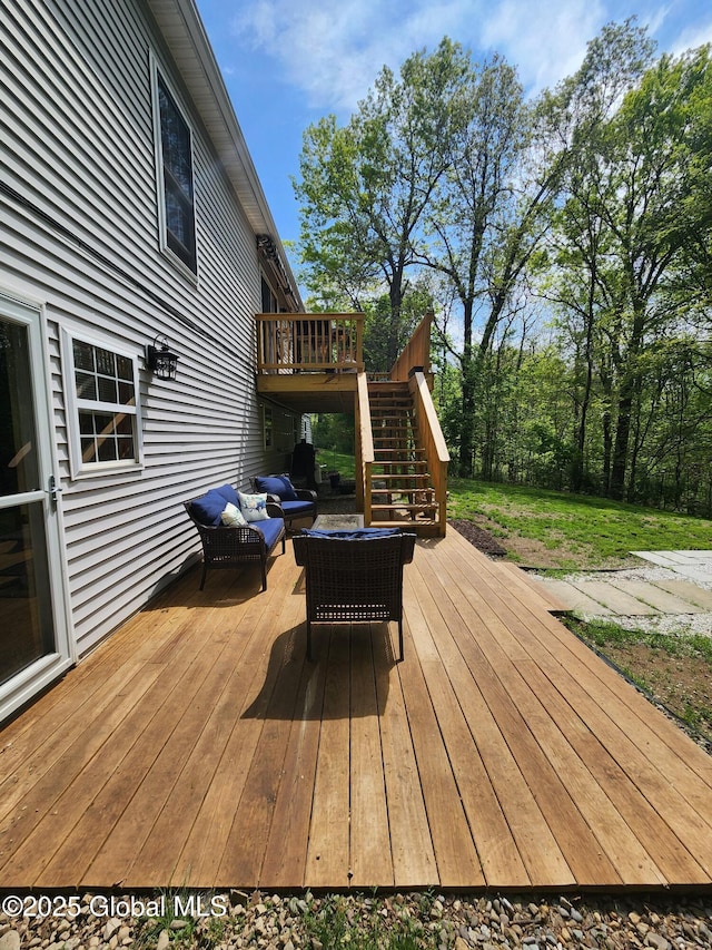 wooden terrace featuring stairway and an outdoor hangout area