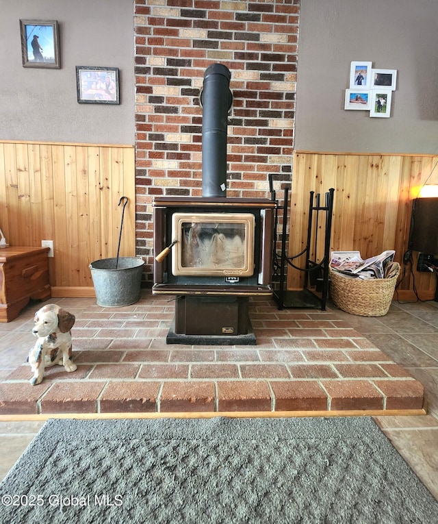 detailed view of wood walls, wainscoting, and a wood stove