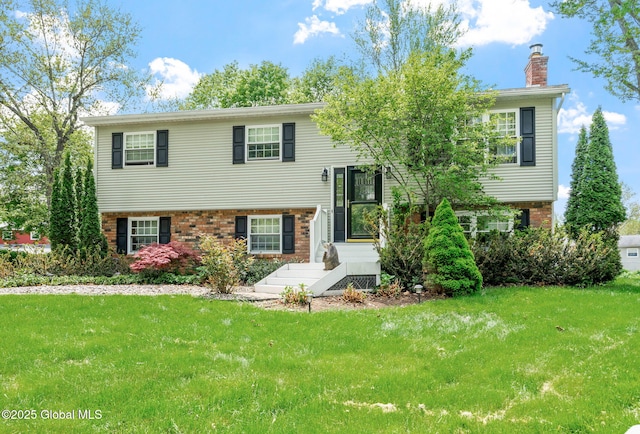 101 Woodview Ct, Voorheesville, NY 12186 - raised ranch with brick siding, a chimney, and a front lawn