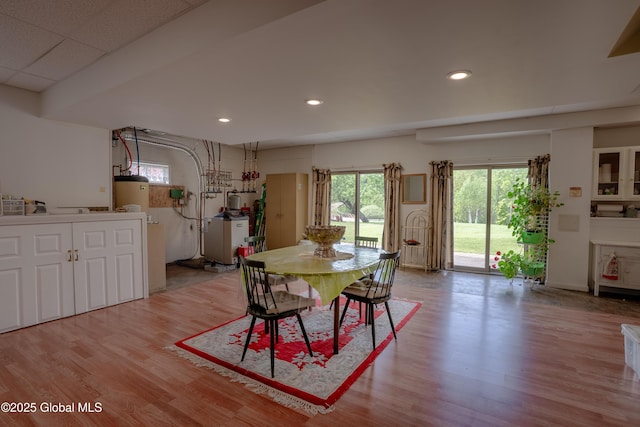 1435 Webster St, Malone, NY 12953 - dining space featuring wood finished floors, water heater, and recessed lighting