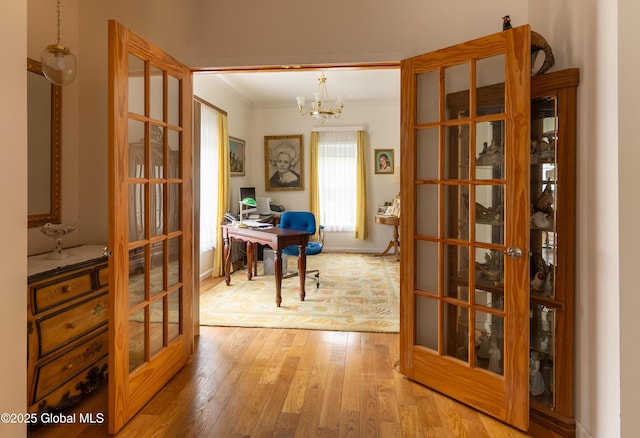 1435 Webster St, Malone, NY 12953 - office area featuring french doors, light wood-type flooring, a chandelier, and ornamental molding