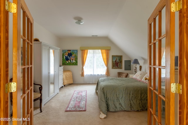 1435 Webster St, Malone, NY 12953 - bedroom featuring french doors, carpet, and lofted ceiling