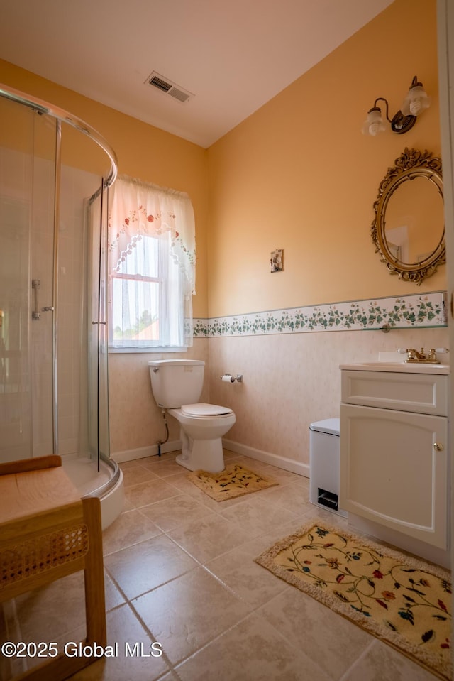 1435 Webster St, Malone, NY 12953 - bathroom with vanity, a shower stall, wainscoting, and tile patterned floors