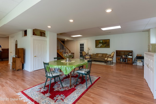 1435 Webster St, Malone, NY 12953 - dining space with light wood-type flooring, stairway, arched walkways, and recessed lighting