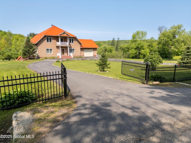 1435 Webster St, Malone, NY 12953 - view of front facade featuring asphalt driveway, a garage, and a balcony