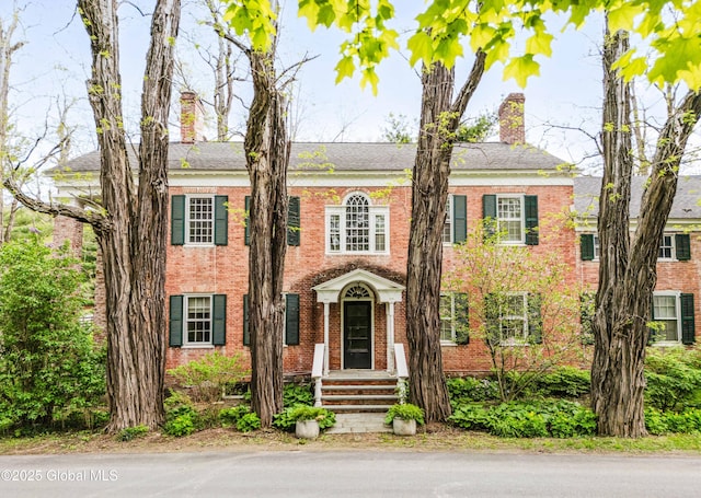 632 Albany Tpke, Chatham, NY 12136 - colonial-style house with a chimney and brick siding