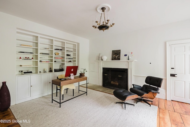 632 Albany Tpke, Chatham, NY 12136 - office space with light wood finished floors, a fireplace with flush hearth, and a chandelier