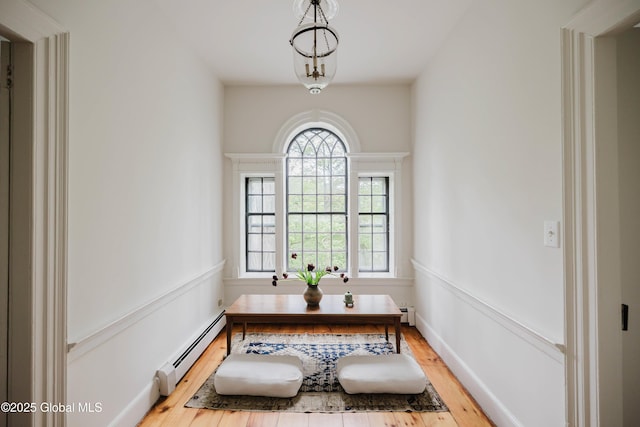 632 Albany Tpke, Chatham, NY 12136 - dining space featuring a baseboard heating unit, wood finished floors, and a baseboard radiator