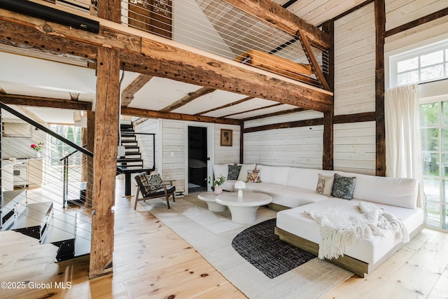 632 Albany Tpke, Chatham, NY 12136 - living room with stairs, wood finished floors, wood walls, and beam ceiling