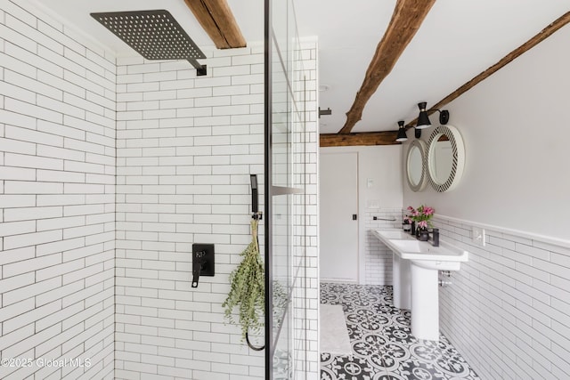 632 Albany Tpke, Chatham, NY 12136 - full bathroom with beam ceiling, a tile shower, tile walls, tile patterned floors, and wainscoting