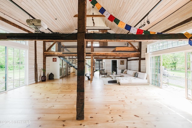 632 Albany Tpke, Chatham, NY 12136 - interior space featuring high vaulted ceiling, wood walls, beamed ceiling, and wood-type flooring