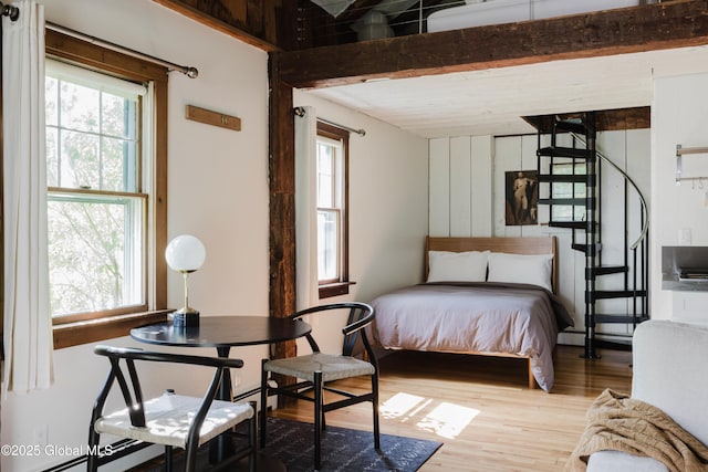 632 Albany Tpke, Chatham, NY 12136 - bedroom featuring wood finished floors, a baseboard radiator, and beam ceiling