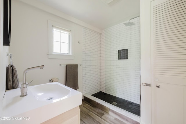 632 Albany Tpke, Chatham, NY 12136 - bathroom with a stall shower, vanity, and wood finished floors