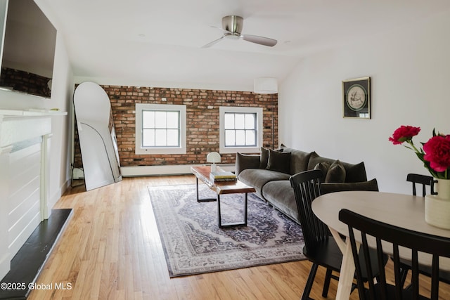 632 Albany Tpke, Chatham, NY 12136 - living area with vaulted ceiling, ceiling fan, hardwood / wood-style floors, and brick wall