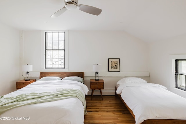 632 Albany Tpke, Chatham, NY 12136 - bedroom featuring baseboard heating, wood finished floors, a ceiling fan, and vaulted ceiling