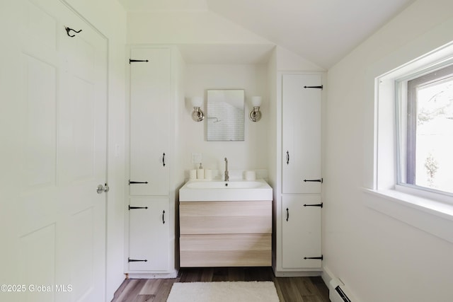 632 Albany Tpke, Chatham, NY 12136 - bathroom with vanity, wood finished floors, and lofted ceiling