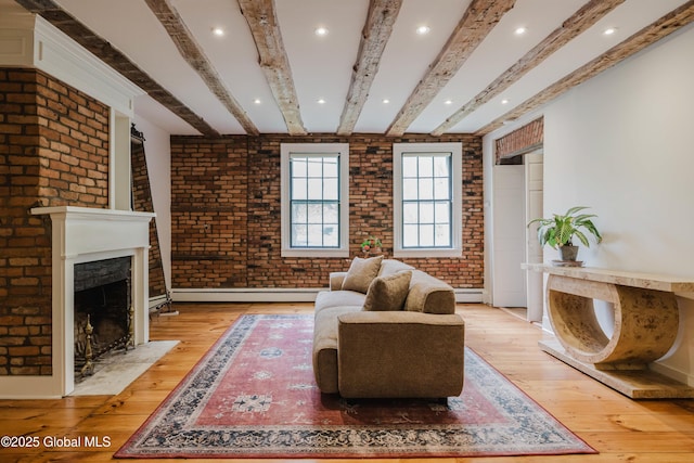 632 Albany Tpke, Chatham, NY 12136 - living area with brick wall, light wood-style flooring, baseboard heating, beam ceiling, and a fireplace with flush hearth