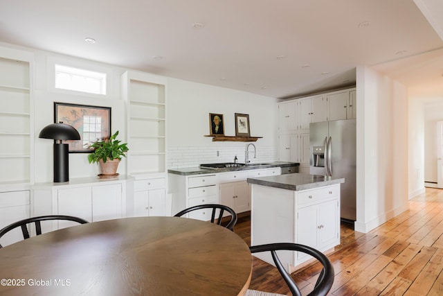 632 Albany Tpke, Chatham, NY 12136 - kitchen with stainless steel fridge with ice dispenser, light wood finished floors, backsplash, open shelves, and recessed lighting