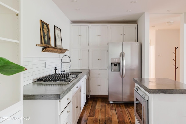 632 Albany Tpke, Chatham, NY 12136 - kitchen featuring appliances with stainless steel finishes, dark wood-style floors, decorative backsplash, white cabinets, and open shelves