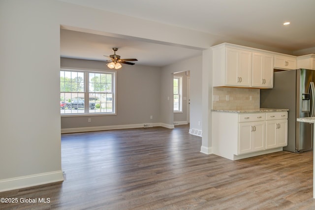 kitchen featuring stainless steel fridge with ice dispenser, healthy amount of natural light, white cabinetry, a ceiling fan, and recessed lighting