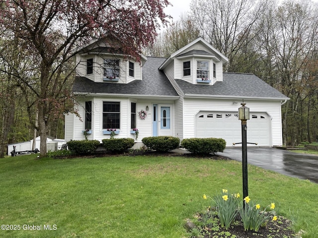 24 Fairmount Dr, Wilton, NY 12831 - view of front of house featuring driveway, roof with shingles, an attached garage, and a front lawn