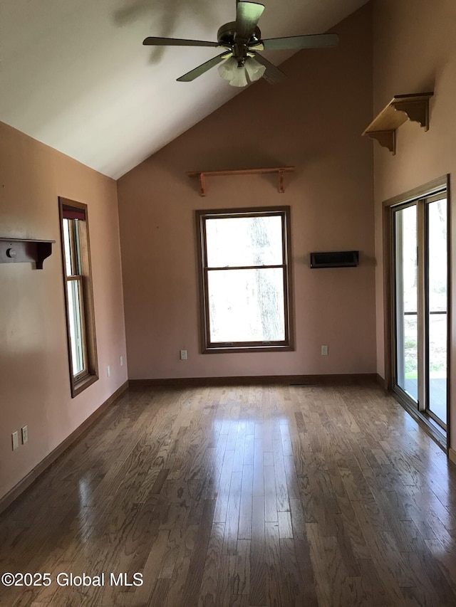 24 Fairmount Dr, Wilton, NY 12831 - unfurnished room featuring lofted ceiling, healthy amount of natural light, a ceiling fan, wood finished floors, and baseboards