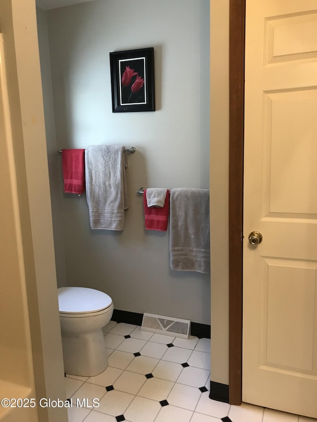 24 Fairmount Dr, Wilton, NY 12831 - bathroom featuring baseboards and toilet