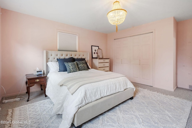 55 Journey Ln, Bethlehem, NY 12077 - bedroom with carpet, a chandelier, a closet, and baseboards