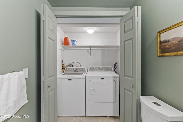 55 Journey Ln, Bethlehem, NY 12077 - laundry area with washing machine and dryer and light tile patterned floors
