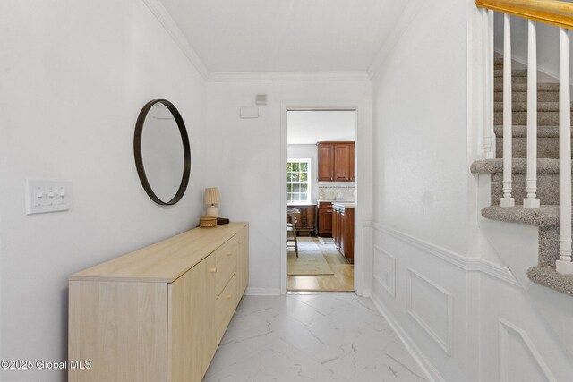 55 Journey Ln, Bethlehem, NY 12077 - hallway with crown molding, stairs, light marble finish floors, and wainscoting