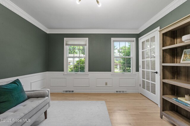 55 Journey Ln, Bethlehem, NY 12077 - sitting room with wood finished floors, wainscoting, and ornamental molding