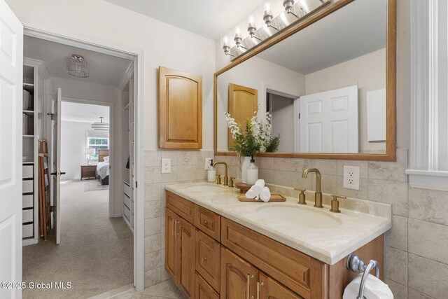 55 Journey Ln, Bethlehem, NY 12077 - full bathroom featuring double vanity, ensuite bathroom, and tile walls