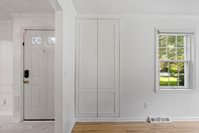 55 Journey Ln, Bethlehem, NY 12077 - entrance foyer featuring ornamental molding, healthy amount of natural light, and light wood-type flooring