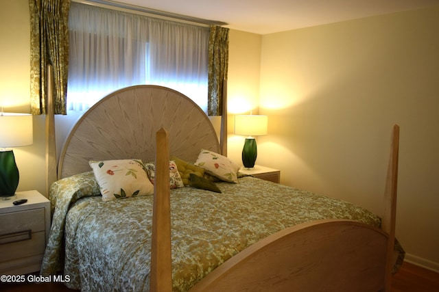 bedroom featuring wood finished floors