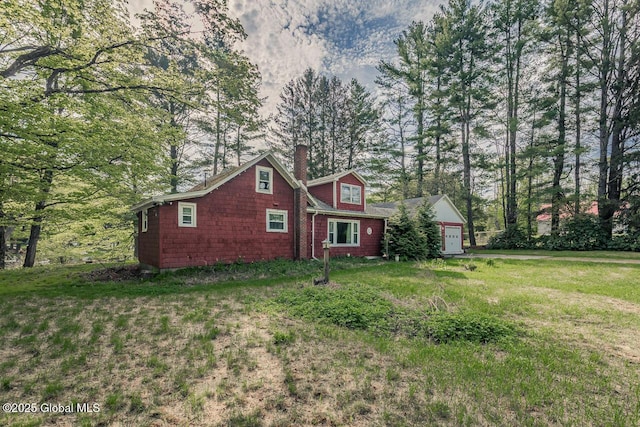 5518 Crooked St, Galway, NY 12074 - view of front of home with a chimney, a front lawn, and a garage