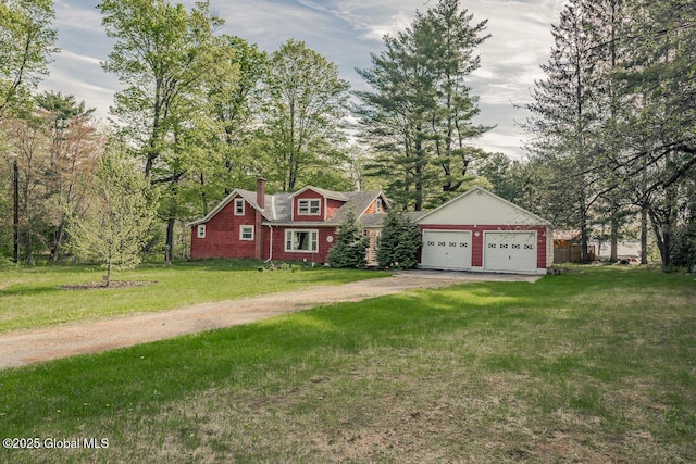 5518 Crooked St, Galway, NY 12074 - view of front of property with a front lawn, a chimney, a detached garage, and driveway