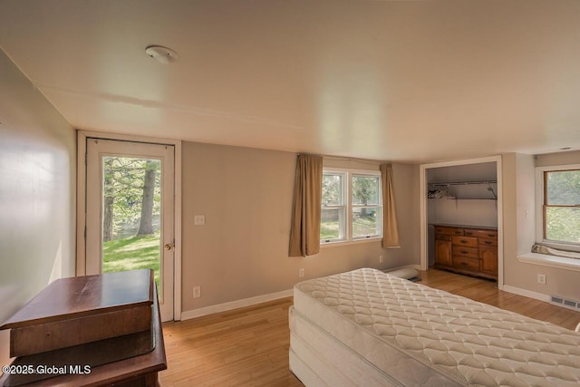 5518 Crooked St, Galway, NY 12074 - bedroom with light wood-style floors, baseboards, and access to outside