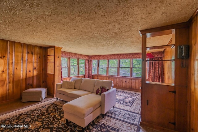 5518 Crooked St, Galway, NY 12074 - living area featuring wood walls and a textured ceiling