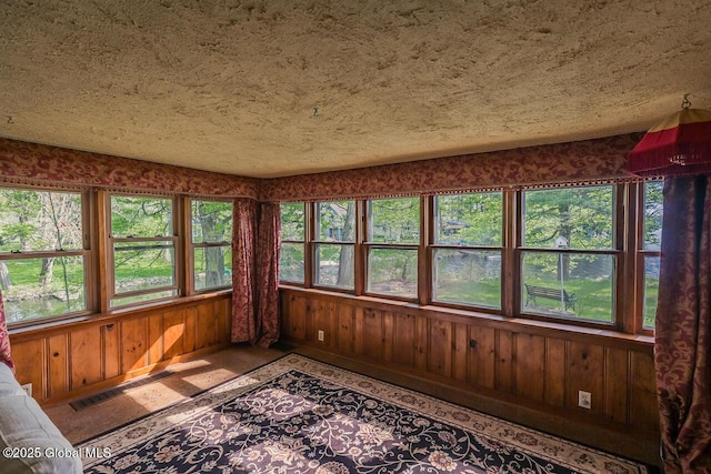 5518 Crooked St, Galway, NY 12074 - unfurnished sunroom featuring plenty of natural light and wood walls