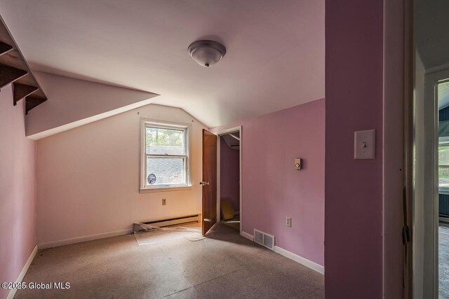5518 Crooked St, Galway, NY 12074 - additional living space featuring a baseboard heating unit, lofted ceiling, and baseboards