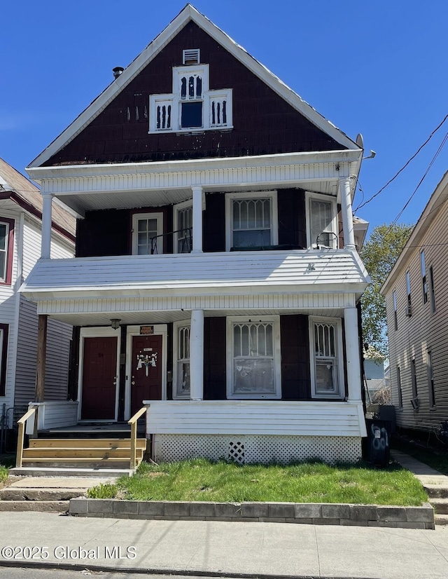 view of front facade featuring a balcony and a porch