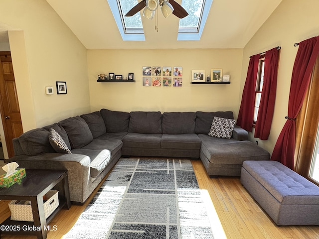 14 Wendom Rd, Albany, NY 12203 - living room featuring lofted ceiling, a skylight, wood finished floors, and a ceiling fan
